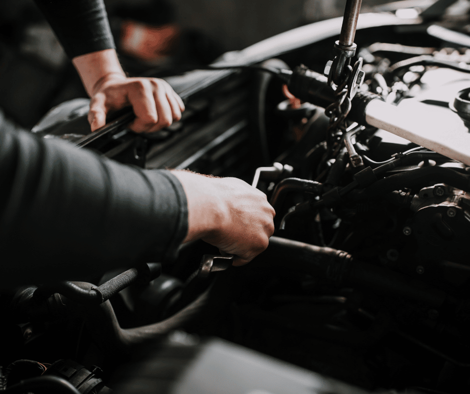 picture of a mechanic working on a car in an auto repair shop