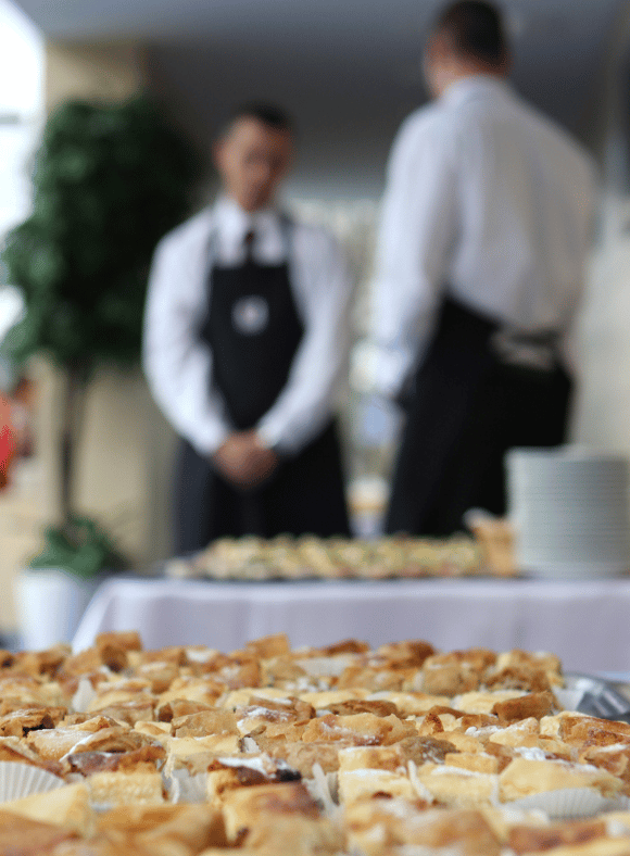 an image of a catering event with two catering employees standing in the background