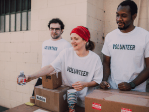 3 volunteers working at a fundraiser event