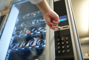 Choosing an option on a vending machine to buy