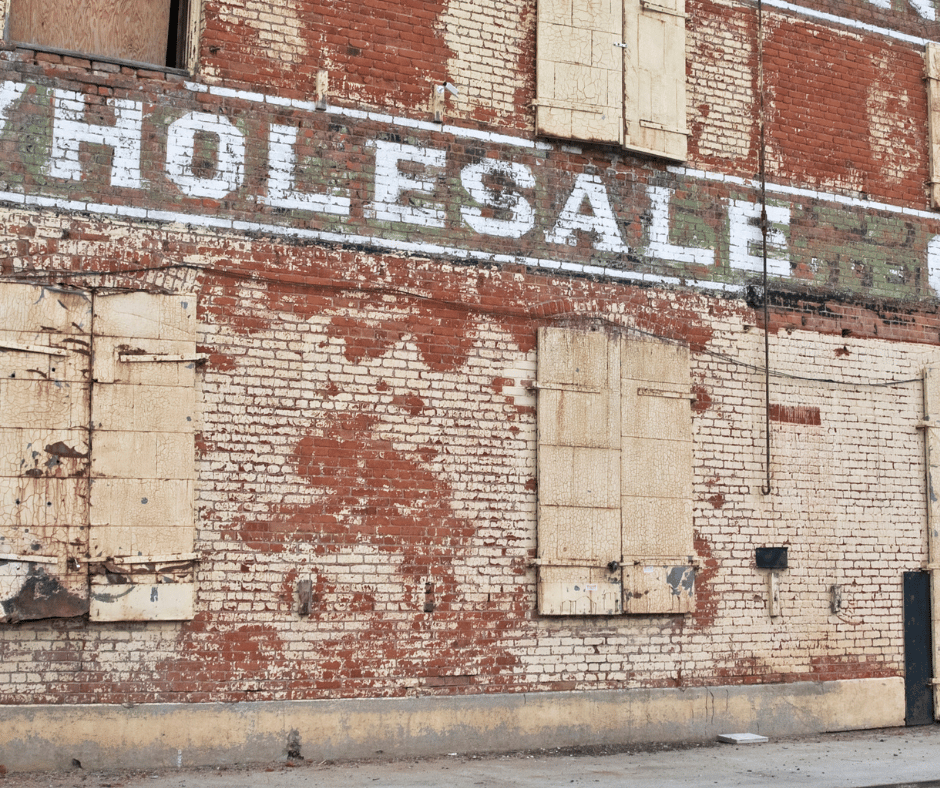 the exterior of a brick wholesale building 