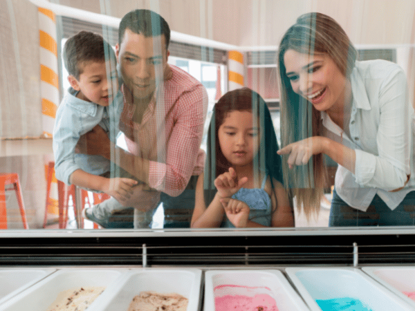 family looking at ice cream case