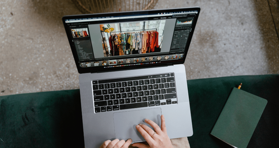 editing a photo of clothing on a laptop