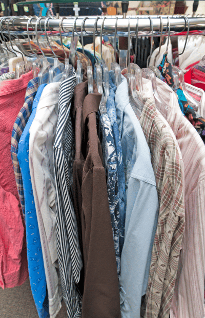 thrift store clothing on rack