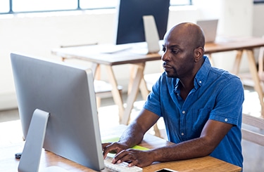 Man working on computer in the office