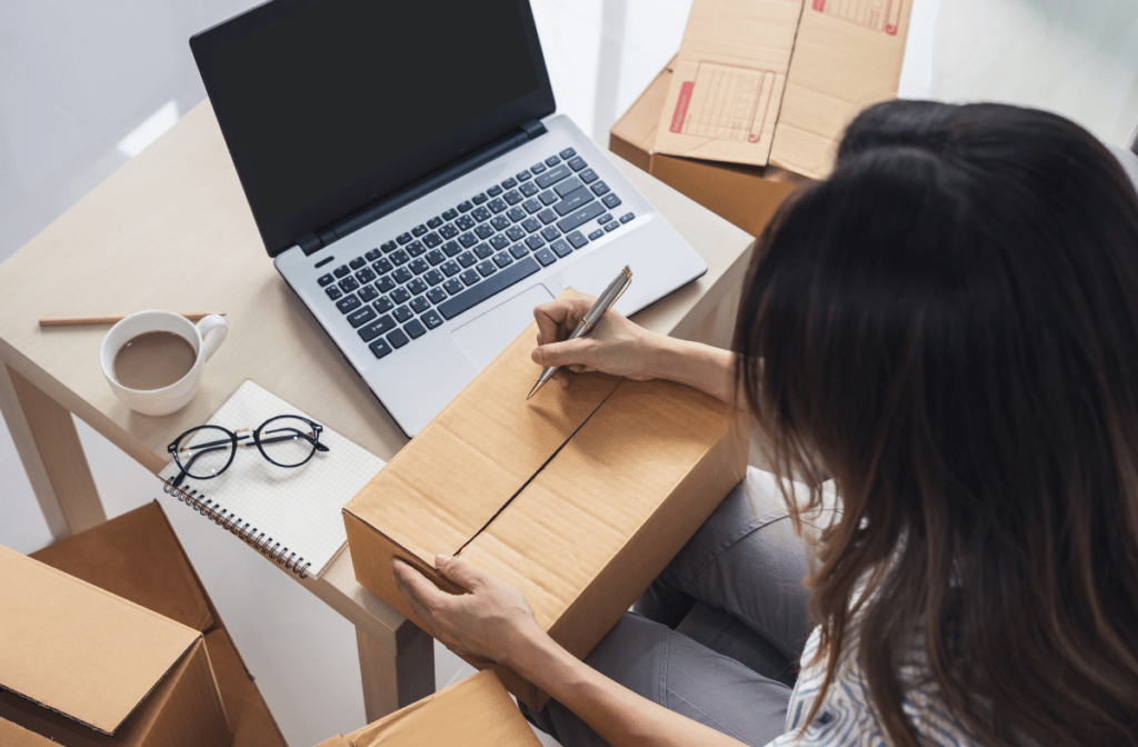 an online business owner working from home and packaging orders
