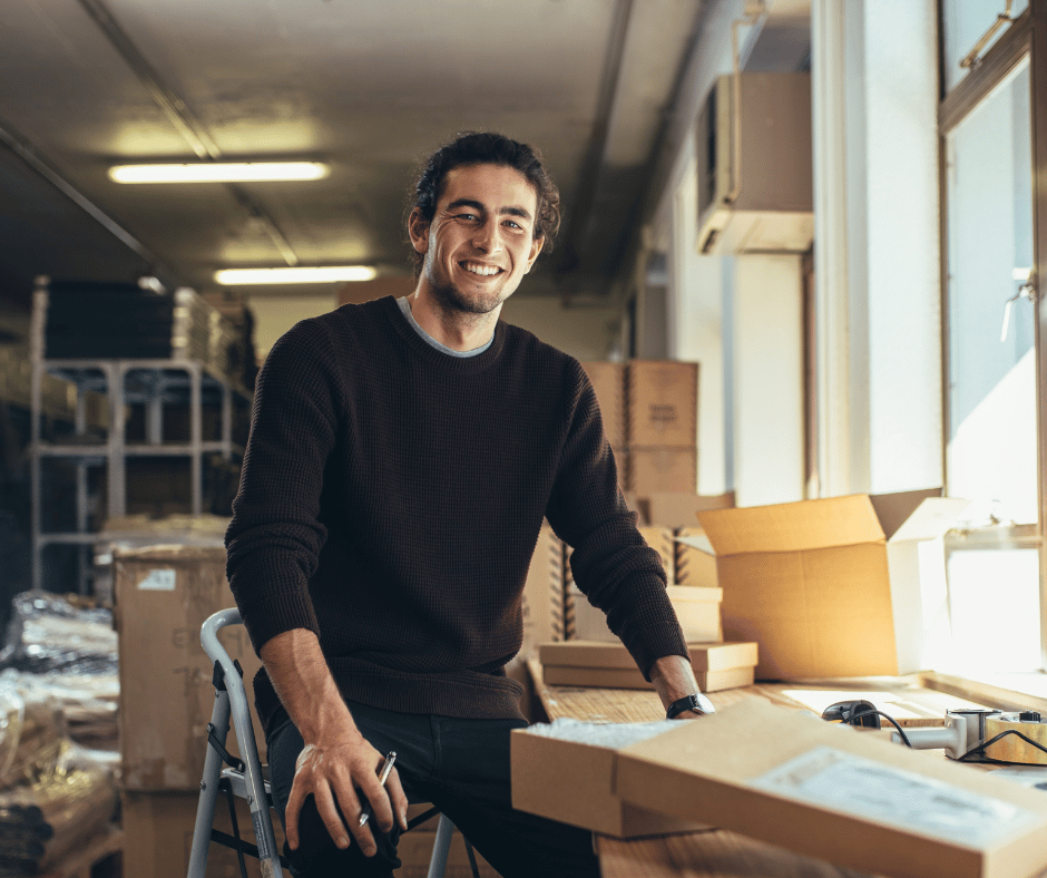 a dropshipping business owner smiling 