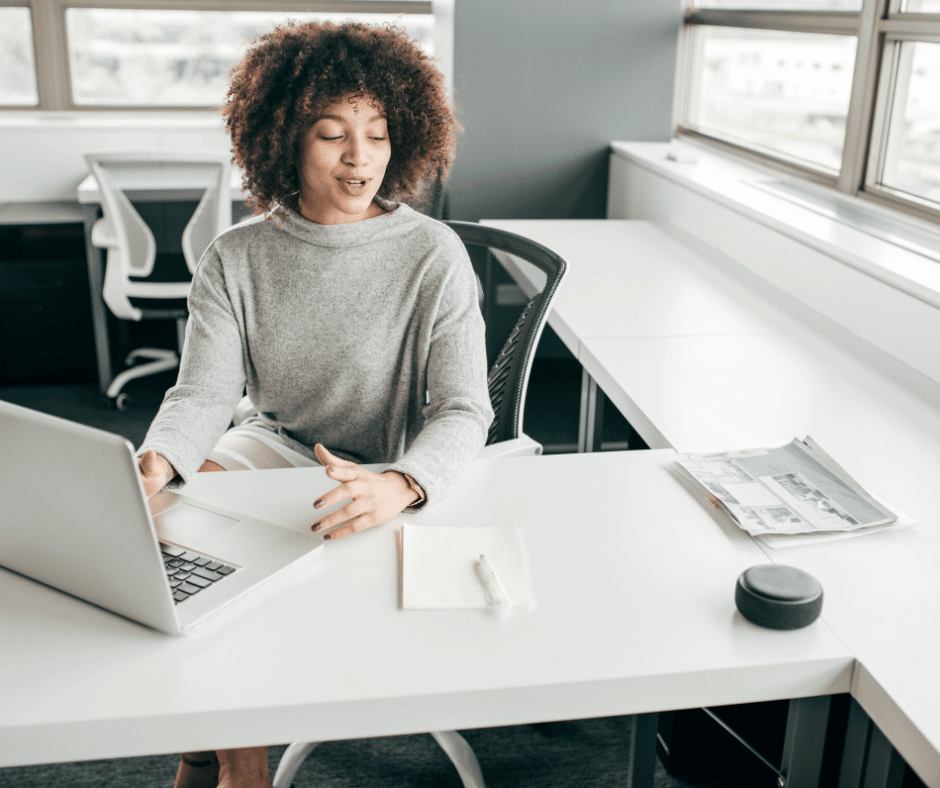 a woman working at a desk as a virtual assistant 